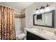 Clean bathroom with tub shower, updated vanity, and tile flooring at 10150 E Virginia Ave # 2-205, Denver, CO 80247