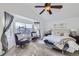 Bright main bedroom featuring a sitting area, large window, and neutral decor at 11262 Winona Ct, Westminster, CO 80031