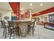 Basement wet bar with stonework and seating for four at 1585 Old Antlers, Monument, CO 80132