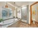 Elegant bathroom with a soaking tub and walk-in shower at 1585 Old Antlers, Monument, CO 80132