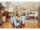 Kitchen and dining area with hardwood floors and access to the back deck at 1585 Old Antlers, Monument, CO 80132