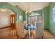 Bright dining room features a glass table and wood floors at 1585 Old Antlers, Monument, CO 80132