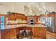 Spacious kitchen featuring granite countertops and stainless steel appliances at 1585 Old Antlers, Monument, CO 80132