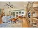 Living room with hardwood floors, high ceilings and stone fireplace at 1585 Old Antlers, Monument, CO 80132