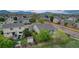 A view from above of a home with a brick patio, fenced yard and professional landscaping at 5350 S Quail Way, Littleton, CO 80127