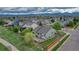 An aerial view of a home with a brick patio, fenced yard, and professional landscaping at 5350 S Quail Way, Littleton, CO 80127