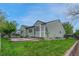 Relaxing backyard featuring a brick patio and lush greenery, perfect for outdoor entertaining at 5350 S Quail Way, Littleton, CO 80127