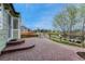 Backyard featuring brick patio, steps, and fence line at 5350 S Quail Way, Littleton, CO 80127