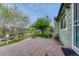 An inviting backyard patio with brickwork, and a lovely view overlooking the community open space at 5350 S Quail Way, Littleton, CO 80127