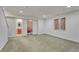 Spacious basement area with carpet, a window, and access to a bathroom and bedroom at 5350 S Quail Way, Littleton, CO 80127