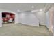 Basement area with carpet and access to a bathroom and secondary living space at 5350 S Quail Way, Littleton, CO 80127