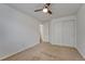 Neutral bedroom featuring plush carpet, a ceiling fan, and a double door closet at 5350 S Quail Way, Littleton, CO 80127