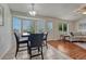 Cozy dining area featuring tile floors, a bay window, and is open to the living area at 5350 S Quail Way, Littleton, CO 80127