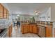 Bright kitchen with a breakfast nook, stainless steel appliances, and tile backsplash at 5350 S Quail Way, Littleton, CO 80127