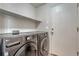 Laundry room with a modern front load washer and dryer at 5350 S Quail Way, Littleton, CO 80127