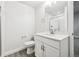 Clean basement bathroom with white vanity, shower, and toilet at 24955 E 41St Ave, Aurora, CO 80019