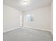 Bright, spacious basement bedroom with grey carpeting and an egress window at 24955 E 41St Ave, Aurora, CO 80019