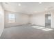 Spacious bedroom with carpeted floors and a window offering natural light at 24955 E 41St Ave, Aurora, CO 80019