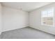 Simple bedroom with grey carpet and one window, ready for personalization at 24955 E 41St Ave, Aurora, CO 80019