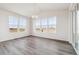 Bright dining room with hardwood floors and large windows at 24955 E 41St Ave, Aurora, CO 80019