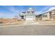 Two-story house with gray siding, stone accents, and a two-car garage at 24955 E 41St Ave, Aurora, CO 80019