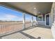 Covered front porch with white railings and views of the surrounding area at 24955 E 41St Ave, Aurora, CO 80019