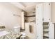 Accessible bathroom featuring a walk-in tub and vanity with granite countertop at 350 S Clinton St # 9B, Denver, CO 80247