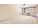 Comfortable bedroom with neutral carpet and large window with views at 350 S Clinton St # 9B, Denver, CO 80247