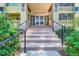 The entrance of 350 S Clinton St features a brick design, beautiful stairway, and glass doors for a stunning visual at 350 S Clinton St # 9B, Denver, CO 80247