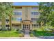 A full shot of 350 S Clinton St showing the beautifully landscaped exterior with brick design and a clean lush lawn at 350 S Clinton St # 9B, Denver, CO 80247