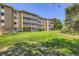 Well-maintained apartment building with spacious balconies and lush green grounds at 350 S Clinton St # 9B, Denver, CO 80247