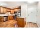 The kitchen offers stainless steel appliances, granite countertops, updated lighting, and beautiful oak cabinets at 350 S Clinton St # 9B, Denver, CO 80247