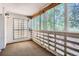 Enclosed patio area filled with natural light through large windows and unique block wall feature at 350 S Clinton St # 9B, Denver, CO 80247