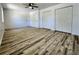 Spacious bedroom featuring neutral walls, wood-look flooring, and a ceiling fan at 16800 E Bails Pl, Aurora, CO 80017
