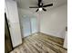 Bright eat-in nook with sliding glass doors, laminate floors, and white cabinets at 16800 E Bails Pl, Aurora, CO 80017