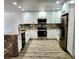 Modern kitchen featuring stainless steel appliances, granite countertops, and white cabinets at 16800 E Bails Pl, Aurora, CO 80017