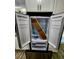 New stainless steel refrigerator with french door and water/ice dispenser at 16800 E Bails Pl, Aurora, CO 80017
