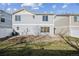 The home's backyard, featuring tidy landscaping, is ready for outdoor entertaining and relaxation at 5202 Cathay St, Denver, CO 80249