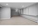 A basement with a carpet and windows at 2308 Hearth Dr # 28, Evergreen, CO 80439