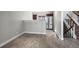 Dining area with wood-look tile flooring, neutral paint, and stainless-steel refrigerator at 2308 Hearth Dr # 28, Evergreen, CO 80439