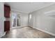 Dining area with wood-look tile flooring, neutral paint, and large windows at 2308 Hearth Dr # 28, Evergreen, CO 80439