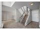 Light-filled entryway featuring a staircase, tiled floor, and neutral wall color at 2308 Hearth Dr # 28, Evergreen, CO 80439