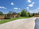 Beautiful backyard featuring a well-maintained lawn, stone patio, and wooden fence at 800 Boulder Peak Ave, Erie, CO 80516