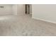 Large basement area with gray carpet, recessed lighting, and finished walls at 800 Boulder Peak Ave, Erie, CO 80516
