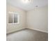 Finished bedroom with a window, neutral carpet, and an air vent at 800 Boulder Peak Ave, Erie, CO 80516