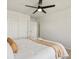 Bright bedroom with light walls features updated ceiling fan and ensuite bathroom at 800 Boulder Peak Ave, Erie, CO 80516