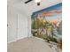 Bedroom with a hand painted mountain mural, carpeted floor, and closet at 800 Boulder Peak Ave, Erie, CO 80516