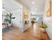 Inviting entryway with hardwood floors and light walls leads to a bright living space at 800 Boulder Peak Ave, Erie, CO 80516