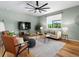 Comfortable living room with large window, hardwood floors and modern decor at 800 Boulder Peak Ave, Erie, CO 80516