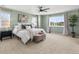 Stylish bedroom boasts fresh wall paint, plush carpet, and lots of natural light at 800 Boulder Peak Ave, Erie, CO 80516